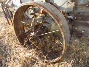 25 year collection of antique  steel farm equipment wheels