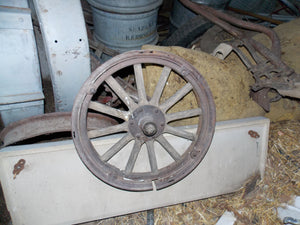 25 year collection of antique  steel farm equipment wheels