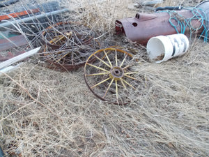 25 year collection of antique  steel farm equipment wheels