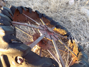 25 year collection of antique  steel farm equipment wheels