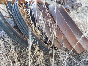 25 year collection of antique  steel farm equipment wheels