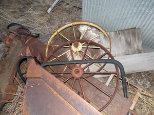 25 year collection of antique  steel farm equipment wheels