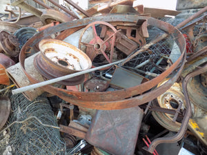 25 year collection of antique  steel farm equipment wheels