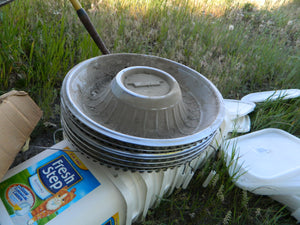 6 Cadillac hubcaps